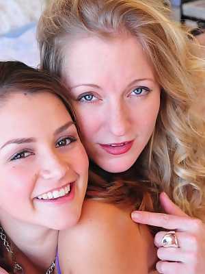 Teen Allie Haze and MILF Dia Zerva strip and kiss each other in bed