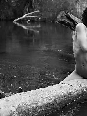 Ally Milano Ally poses nude by the river