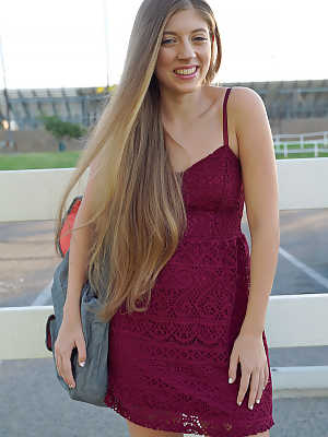 Petite teenage lady Alyce Anderson posing in her sexy dress outdoors