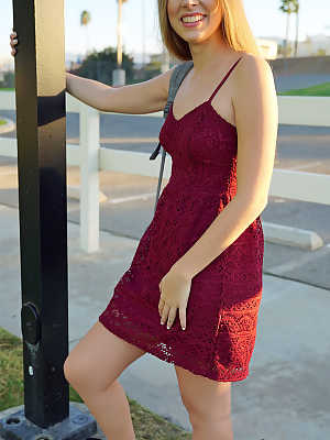 Petite teenage lady Alyce Anderson posing in her sexy dress outdoors