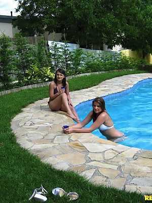 Arousing european babes showing their butts in bikinis at the pool