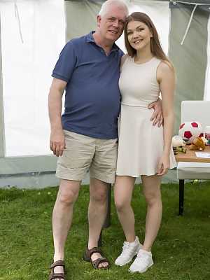 Horny Russian teen Amanda Clarke having sex with an old man in an outdoor tent