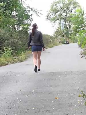 Leggy girl Amanda Hill pulls down shorts and panties for a pee on a paved path