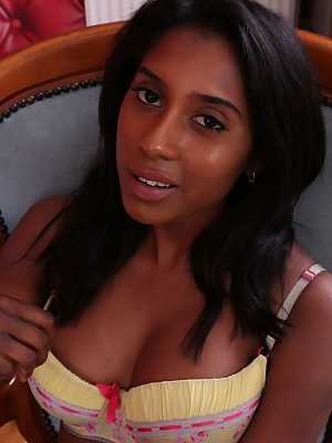 Ebony princess Amber Hill peels off yellow dress & poses in lingerie at work