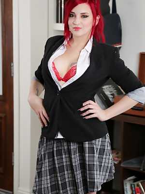 Sexy redhead schoolgirl Amber Ivy takes off red lingerie to show juicy shapes
