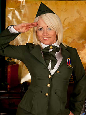 Platinum blonde Amber Jewell salutes before freeing her body from army uniform