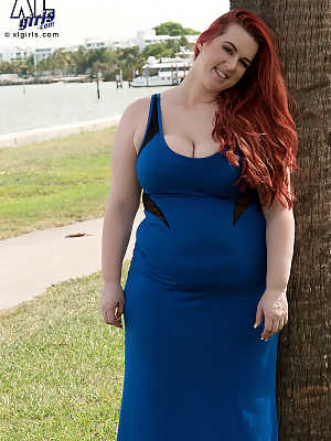 Redhead BBW Amerie Thomas runs water over her big tits after modeling a dress