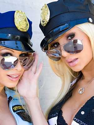 Busty blonde chicks in police attire force a man into having a threesome