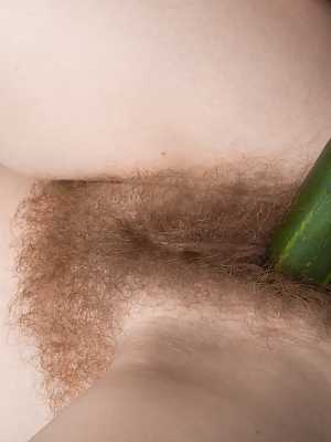 Hot housewife Ana Molly sucks a huge cucumber & inserts it in her hairy pussy