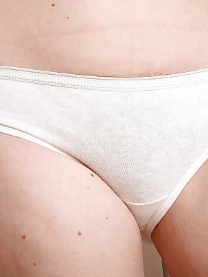 Redheaded wife Ana Molly posing in white panties before revealing beaver