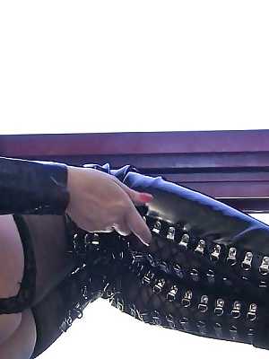 BDSM milf in latex suit Anastasia Pierce pets her hard nipples