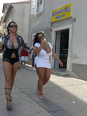 Lesbian women Aneta Buena & Kora Kryk play with their big tits in public