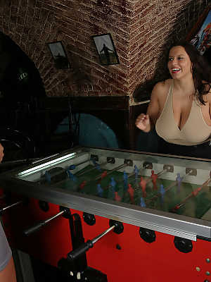 Big titted lesbians Aneta Buena and Ines Cudna kiss after playing foosball