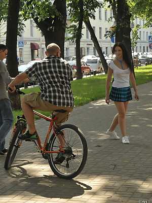 Sweet schoolgirl Angel Dickens in uniform flashes naked upskirt in the park