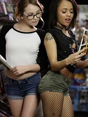 Cute Ebony babe and skinny sweetie become closer thanks to the comics store