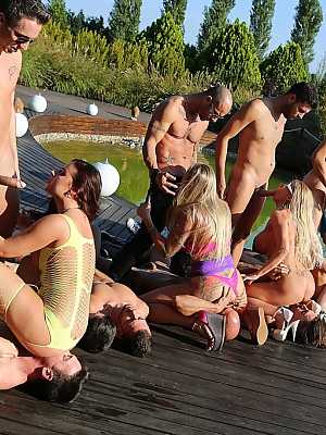 A group of dirty-minded sluts get fucked outdoors by a group of horny guys