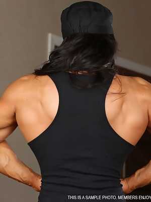 Scary bodybuilder Angela Salvagno flexes her muscles wearing only stockings