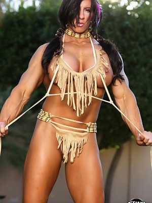 Muscled female Angela Salvagno exposes her big clit in Native American garb