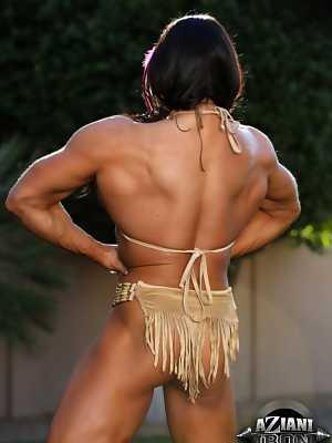 Bodybuilder Angela Salvagno flexes her muscles in Native American clothing