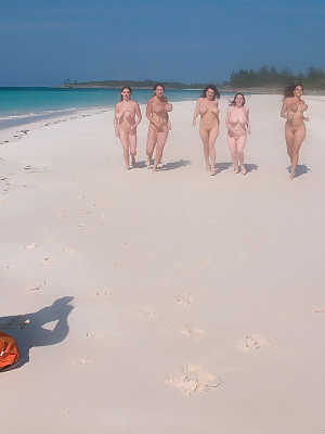 Hot MILF women stripping bikinis to bare big tits on the beach