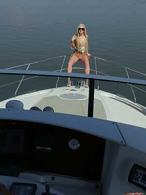 Blonde Russian teen babe Angie Koks gets fucked by two men on the yacht