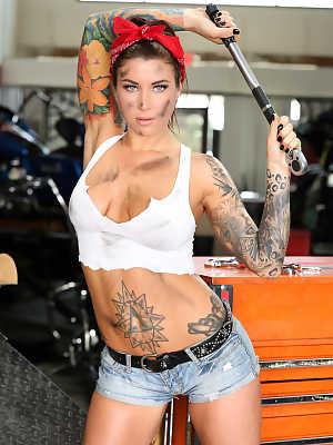 Sexy tattooed biker mechanic Felicity Feline masturbating at her shop