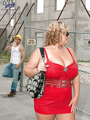 Busty blond bbw in red skirt gets caressed and kissed by a construction worker