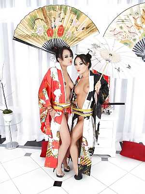Asian vixens Annie Cruz & Asa Akira stripping and playing with butt plugs