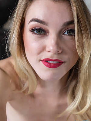 Sexy blonde with red lips takes an upskirt selfie before giving a handjob