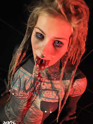 Totally tattooed girl Anuskatzz spits out blood after having her tongue split