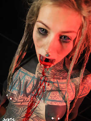 Totally tattooed girl Anuskatzz spits out blood after having her tongue split