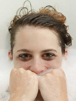 Naturally busty teenage girlfriend taking a bubble bath and posing nude