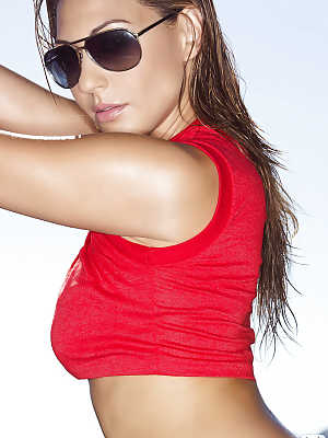 Brunette hottie in sunglasses Ariana Loken uncovering her graceful body