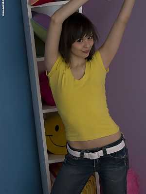 Teen amateur Ariel Rebel exposes her belly button during non nude action