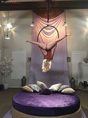 Superb blonde doll Arya Fae doing aerial yoga and showing her tits and ass