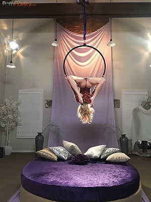 Superb blonde doll Arya Fae doing aerial yoga and showing her tits and ass