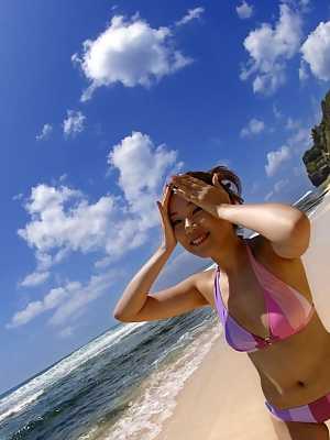 Japanese chick Asami Ogawa exposes her small tits while changing swimwear