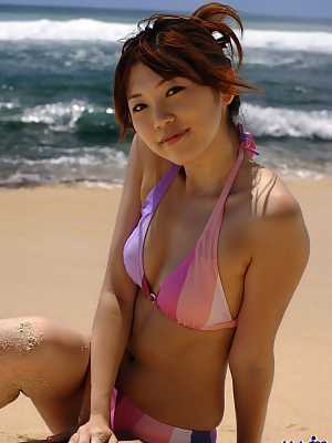 Japanese chick Asami Ogawa exposes her small tits while changing swimwear