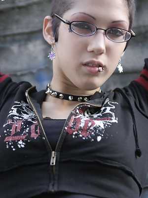 Gothic slut with sexy glasses Asphyxia flashes her ass and pussy outdoors