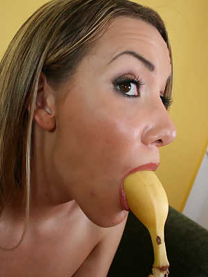 Salacious hottie Audrey Elson deepthroats a banana with natural tits displayed