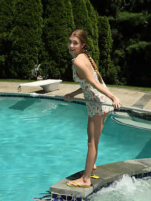 Young amateur Audrey Hempburne shows her wide open pussy by the pool