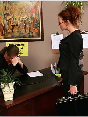 Redhead MILF in glasses Audrey Hollander takes deep anal in the office