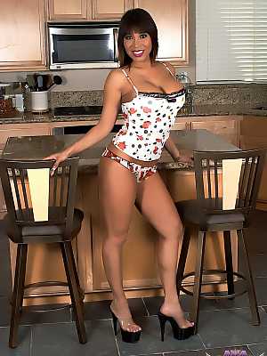 Sexy Asian slut Ava Devine	strips on the kitchen counter & shows her big juggs