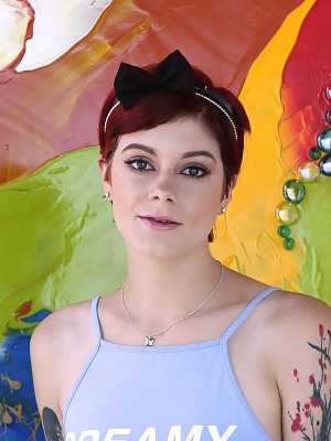 Short-haired redhead with tattooed hands Ava Little spreads legs and buttocks