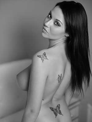 Hot amateur Ava Dawn sets forth her beautiful tits in a black and white shoot