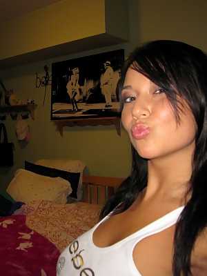 Dark haired amateur Ava Dawn exposes her big naturals during self shot action