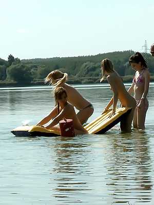 Bikini clad teen girlfriends get all horned up in lesbian picnic games