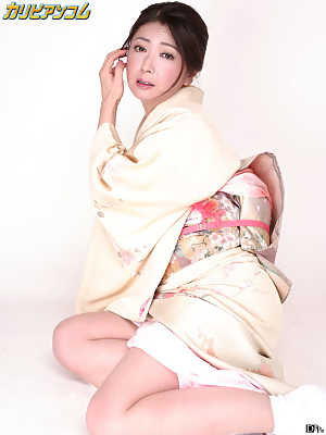 Japanese lady Ayano Murasaki receives a facial while posing in her lingerie