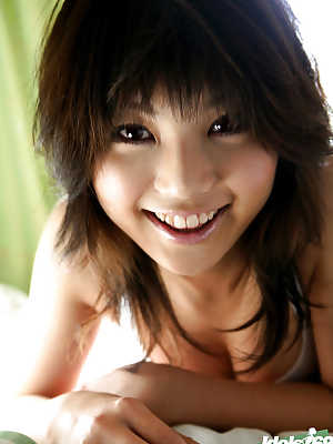 Foxy asian babe Azumi Harusaki uncovering her sweet bosoms