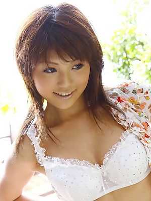 Japanese redhead Azumi Harusaki unleashes her big tits during solo action